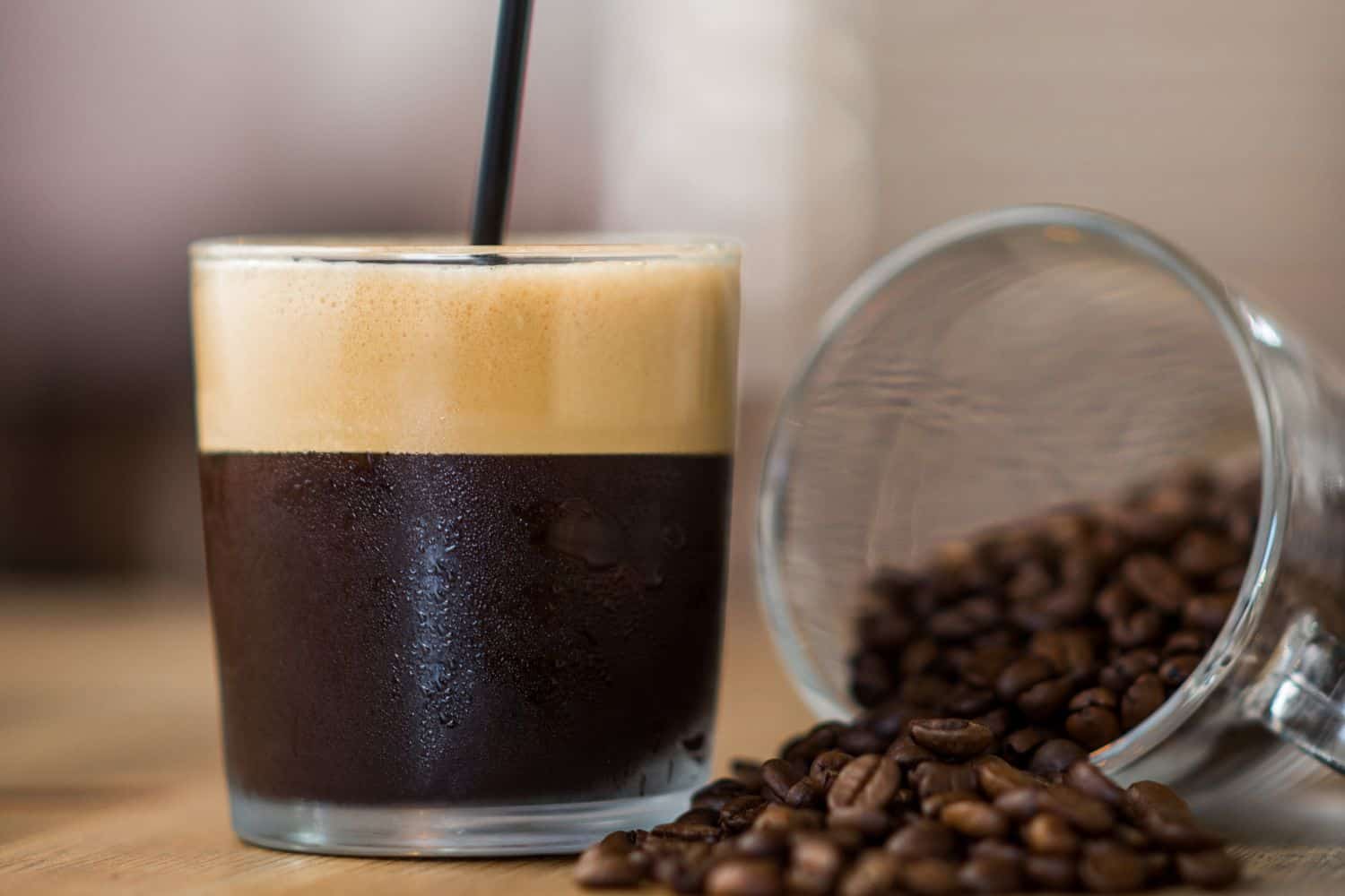 Coffee with crema and roasted coffee beans